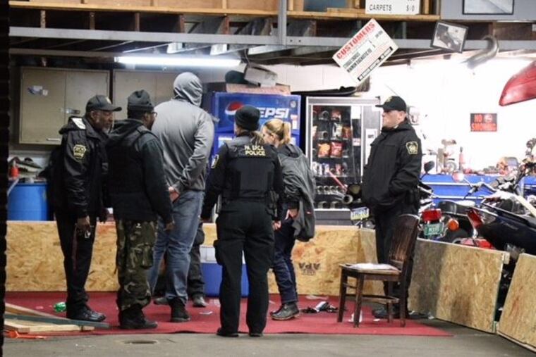 Two pitbull-type dogs were found fighting during a raid of this property on the 1200 block of South 35th Street in South Philadelphia Saturday night. Fourteen people were taken into custody.