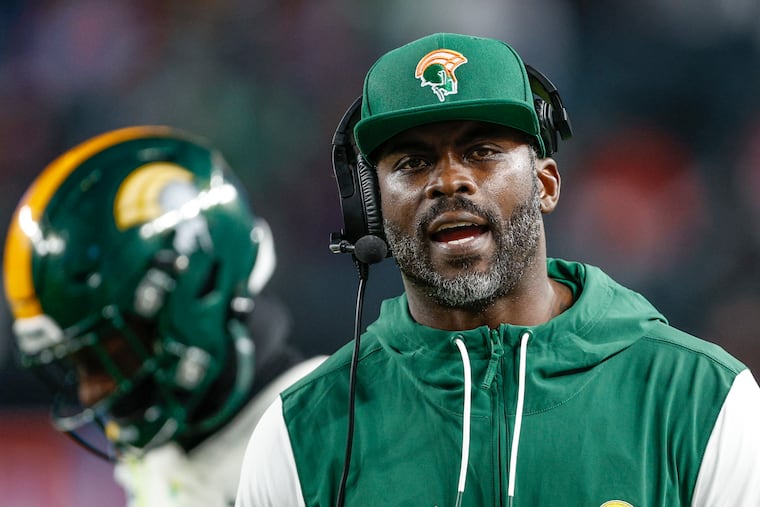 Norfolk State head coach Michael Vick watches his team play Delaware State with head coach DeSean Jackson at Lincoln Financial Field last season.