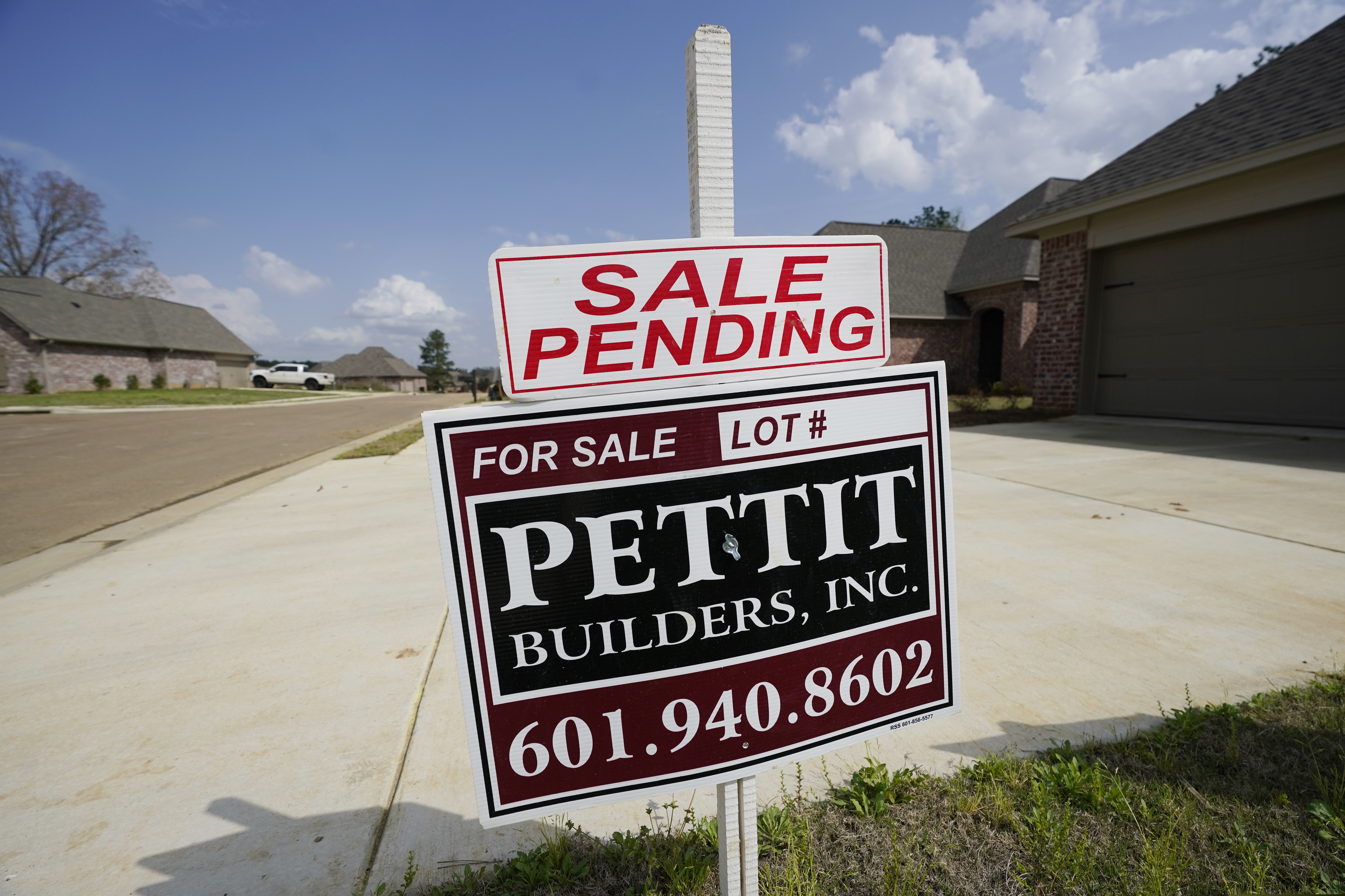 A "Sale Pending" sign stands outside a home in Madison County, Miss.