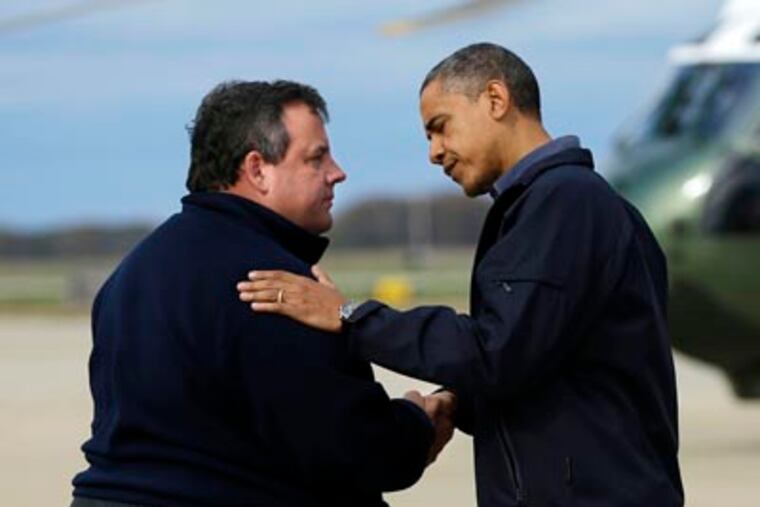President Barack Obama is greeted by Gov. Chris Christie upon his arrival at Atlantic City International Airport. (AP Photo/Pablo Martinez Monsivais)