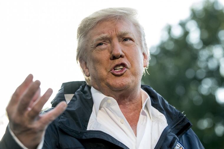 President Trump talks to reporters at the White House before leaving for Puerto Rico on Tuesday.