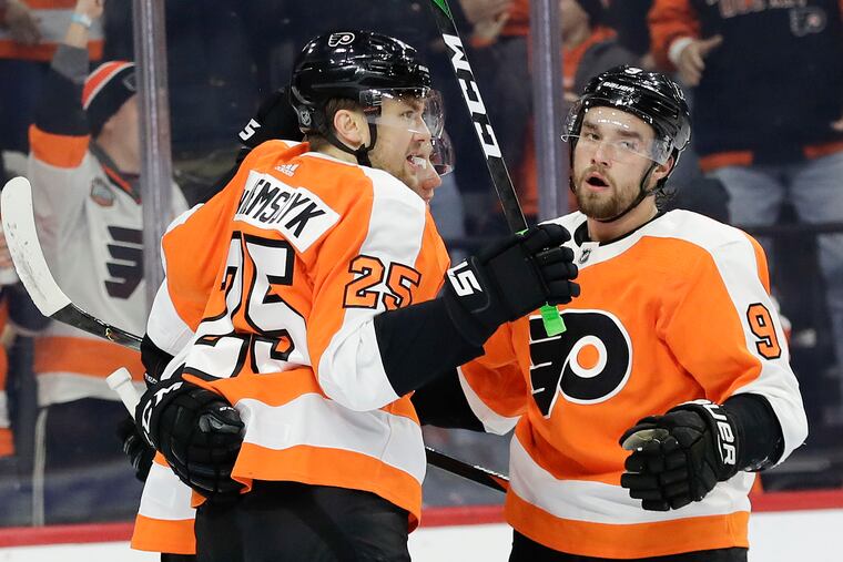 Flyers left wing James van Riemsdyk (25) celebrating his first-period goal Thursday night with teammates Ivan Provorov (9) and Tyler Pitlick during the team's 6-1 win over the Sabres.