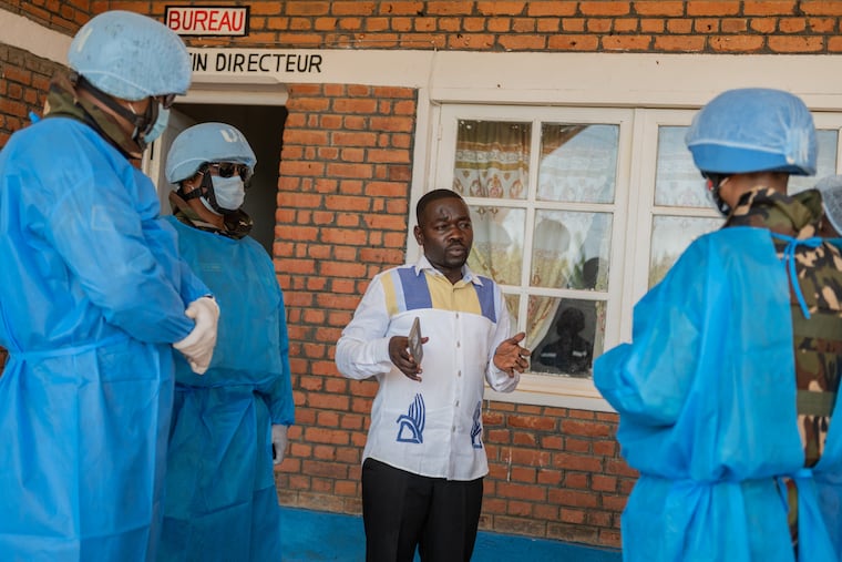 Richard Lokudu, center, the medical director of Mongbwalu General Hospital, speaks with UN peacekeepers in Mongbwalu, Congo, Friday, June 5, 2026.