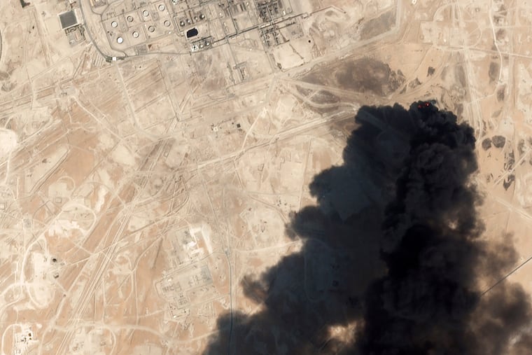 This Saturday, Sept. 14, 2019, satellite image from Planet Labs Inc. shows thick black smoke rising from Saudi Aramco's Abqaiq oil processing facility in Buqyaq, Saudi Arabia. Yemen's Houthi rebels launched drone attacks on the world's largest oil processing facility in Saudi Arabia and a major oil field Saturday, sparking huge fires and halting about half of the supplies from the world's largest exporter of oil. (Planet Labs Inc via AP)