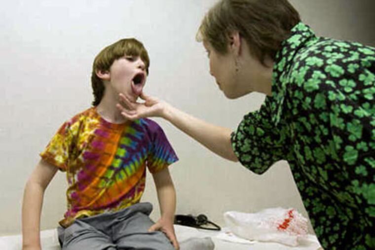 Noah Cohen and his parents hope he may have outgrown the food allergies that have governed his life. (Ed Hille/Staff Photographer)