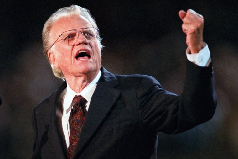 Billy Graham preaches during his 1996 crusade in his hometown of Charlotte, N.C.