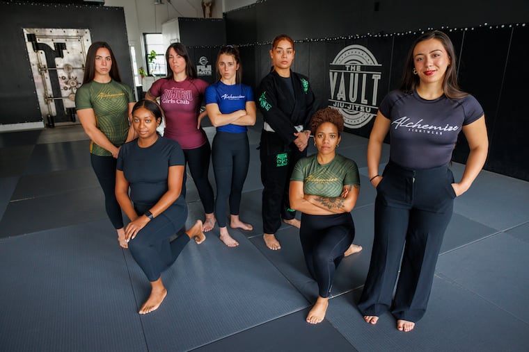 At right is Maya Nazareth founder and CEO of Alchemize Fightwear, Friday, December 5, 2025. She is shown with practitioners of jiu-jitsu the Vault Jiu-Jitsu, Morton, PA, Friday, December 5, 2025. Ladies are wearing Alchemize designed jui-jitsu clothing.