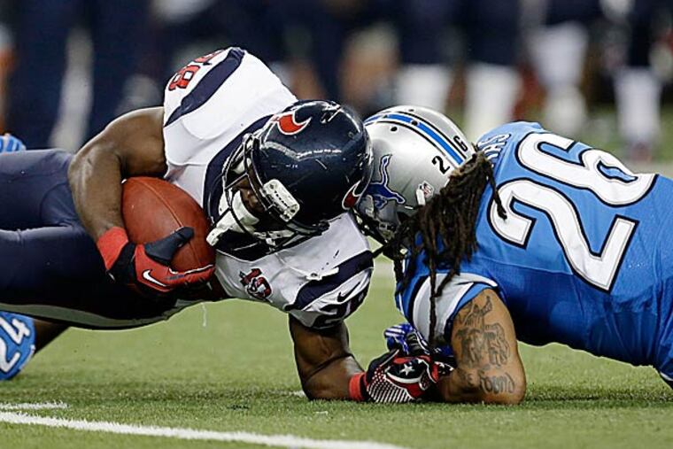 Houston Texans running back Justin Forsett (28) is hit by Detroit
Lions free safety Louis Delmas in Texans territory. Forsett scored a touchdown on this play. (Paul Sancya/AP)