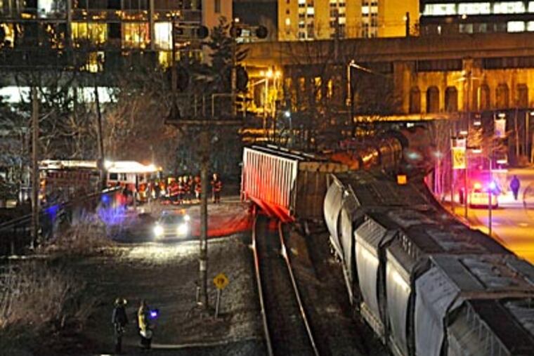 A 115-car train derailed near 23rd and Race St. ( Clem Murray / Staff Photographer )