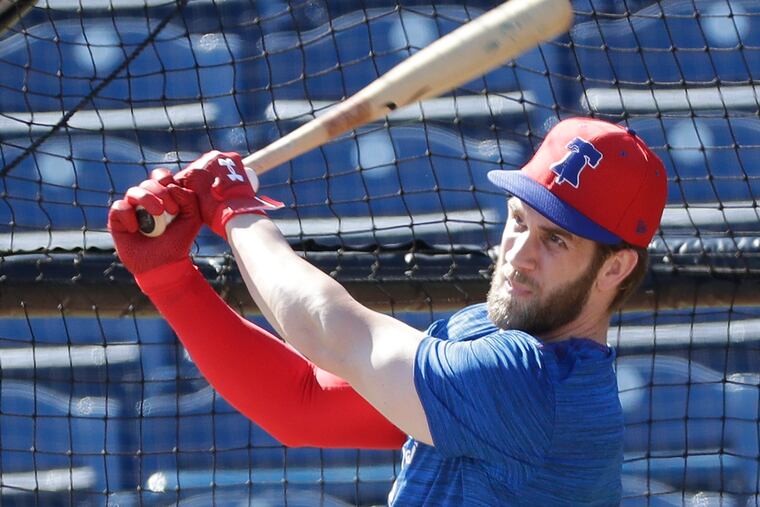 Phillies outfielder Bryce Harper watches the baseball during batting practice on Sunday, March 3, 2019, at Spectrum Field in Clearwater, Fla.