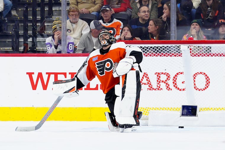 Flyers goaltender Samuel Ersson reacts after giving up a goal to the Utah Hockey Club's Logan Cooley during the second period Sunday.