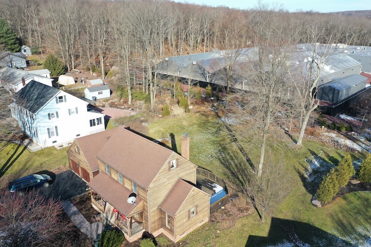 Standard Farms, a marijuana grower is situated near homes in the Poconos town of White Haven, Thursday, Dec. 12, 2019. The cannabis hothouses lie right behind a suburban development.