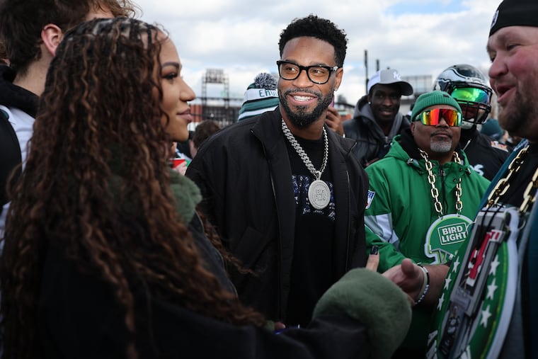Former Eagles cornerback Darius Slay Jr. (center) and his wife Jennifer Slay (left) tailgated with Philly fans before Sunday's game.
