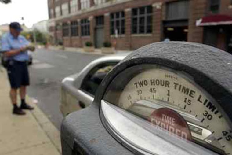 The unforgiving efficiency of the Phila. Parking Authority is the subject of a TV series - and a turnoff to potential visitors. (David Swanson / Staff Photographer)