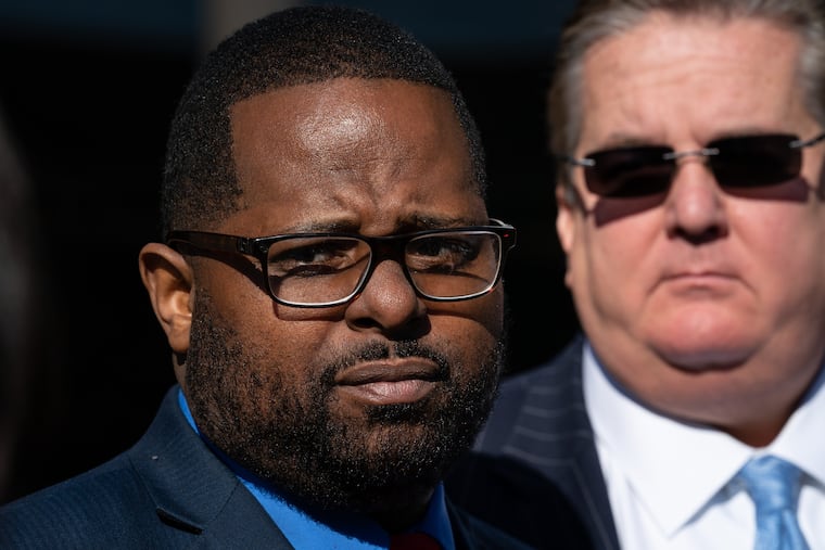 Former Traffic Court judge Willie Singletary, left, and his lawyer William J. Brennan, right, speak with reporters outside the federal courthouse at Sixth and Market Streets after a resentencing hearing in Philadelphia on Wednesday, March 13, 2019.