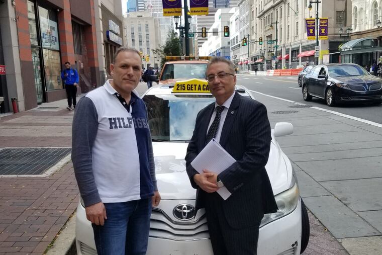 Cab driver Pierre Haifa (left) worries that the new cooperation among cab companies will increase competition. Haifa’s lawyer, Eli Gabay (right), is trying to find a resolution.