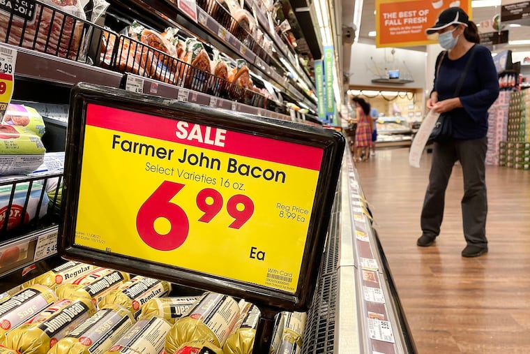 A person shopping in the meat section of a grocery store on Nov. 11, 2021, in Los Angeles.