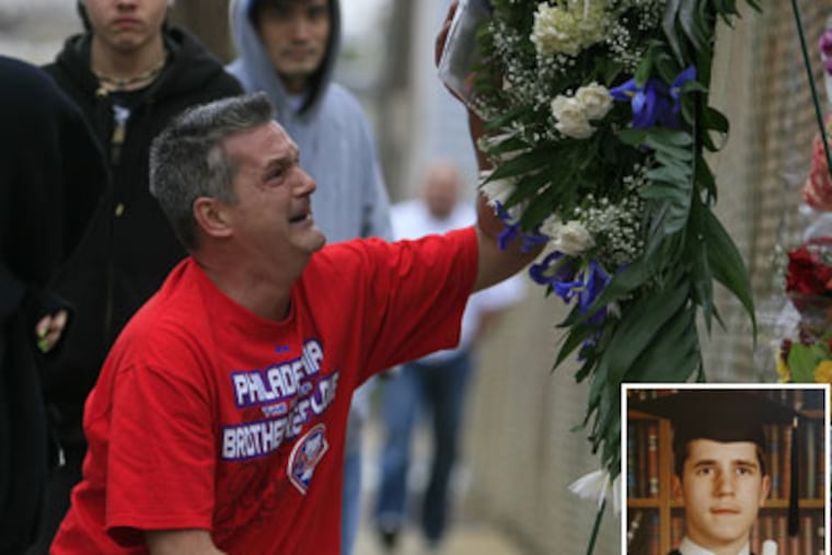 Billy Panas, father of Bill Panas Jr. (inset), touches a picture of his son at a make shift shrine across from the home of the Philadelphia Police officer who shot Bill Jr. in Port Richmond section. (Akira Suwa / Staff Photographer)