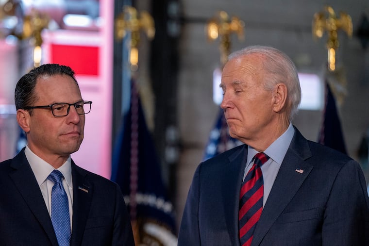 President Joe Biden and Pennsylvania Gov. Josh Shapiro listen as Philadelphia Fire Commissioner Adam Thiel (not shown) expresses his condolences for family members of the victim of a fatal overnight fire in December 2023.