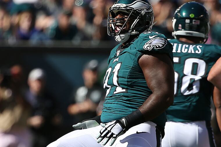 Fletcher Cox celebrates after sacking Saints' quarterback Drew Brees.