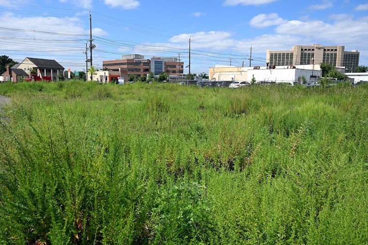 View looking south at Route 70 and South Union Avenue in Cherry Hill. The weedy 12-acre expanse of ground will be redeveloped with two hotels, a restaurant, and a coffee shop. A car wash that has been doing business there since the 1960s will be remodeled as part of the project.