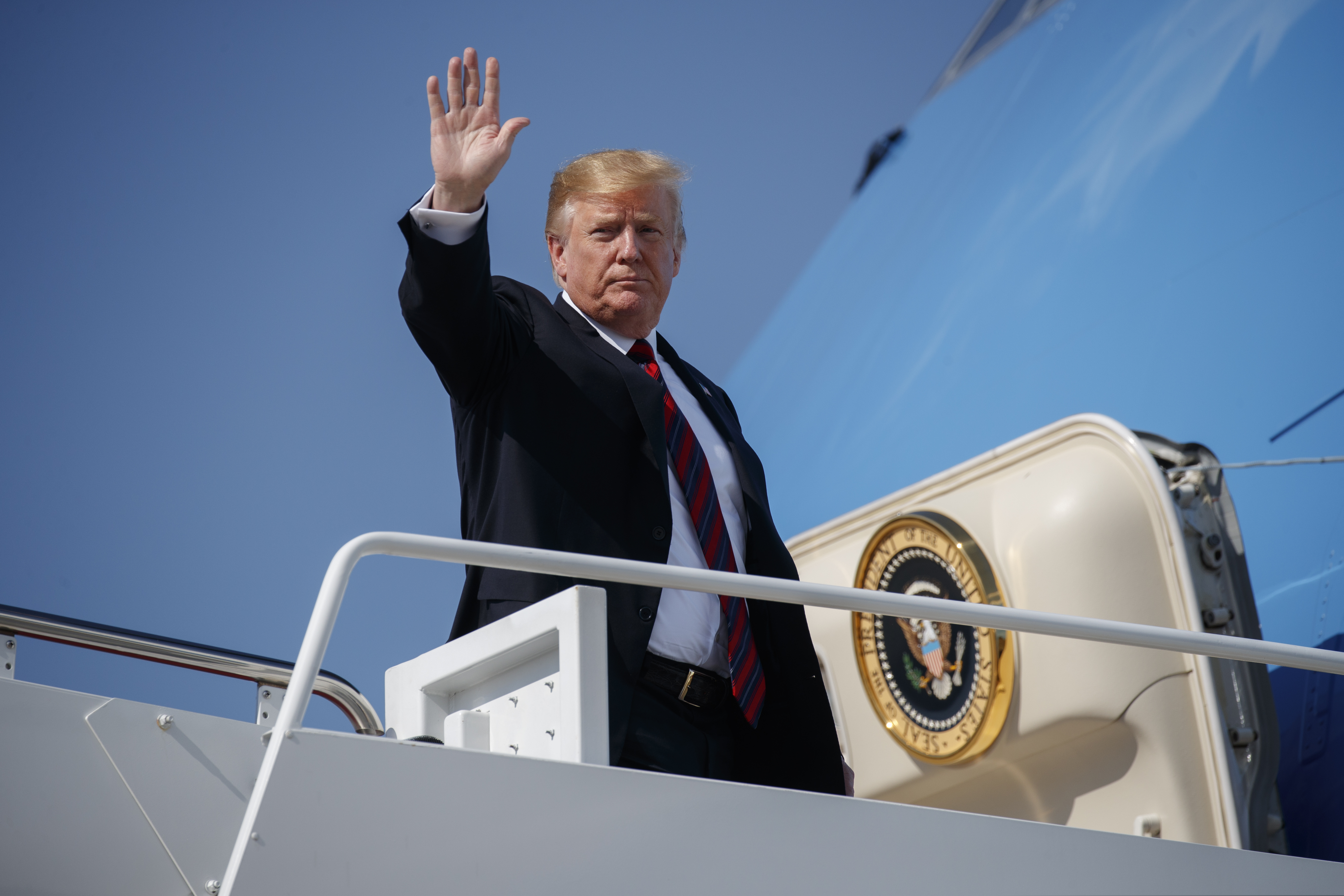 President Donald Trump waves as he boards Air Force One for a trip to New York to attend a fundraiser, Thursday, May 16, 2019, at Andrews Air Force Base, Md.