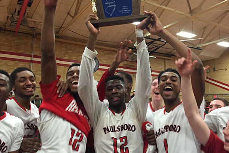 Theo Holloway and his Paulsboro teammates celebrate winning the South Jersey Group 1 title. (Phil Anastasia/Staff)