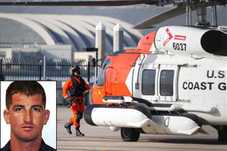 U.S. Coast Guard pilots prepare to go on a search mission at the San Diego Coast Guard Station on Friday. Jason S. Moletzsky (inset), a member of the Coast Guard and native of Norristown, was among those missing. (AP Photo/Denis Poroy)