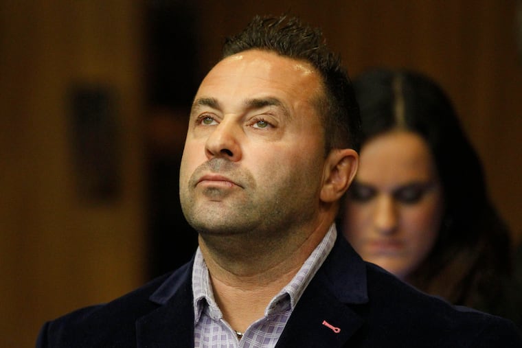 FILE - In this Oct. 15, 2014 file photo, Giuseppe "Joe" Giudice, from the television show "Real Housewives of New Jersey", stands during a hearing in the Passaic County Courthouse in Paterson, N.J. A federal court ruled this week that Giudice can stay in the U.S. as his appeal progresses. Giudice and his wife, Teresa, pleaded guilty in 2014 to financial fraud. Teresa Giudice served her sentence first and was released in December 2015. In an order published Wednesday, May 22, 2019, the 3rd U.S. Circuit Court of Appeals in Philadelphia delayed Giudice’s deportation. (William Perlman/NJ Advance Media via AP, Pool)