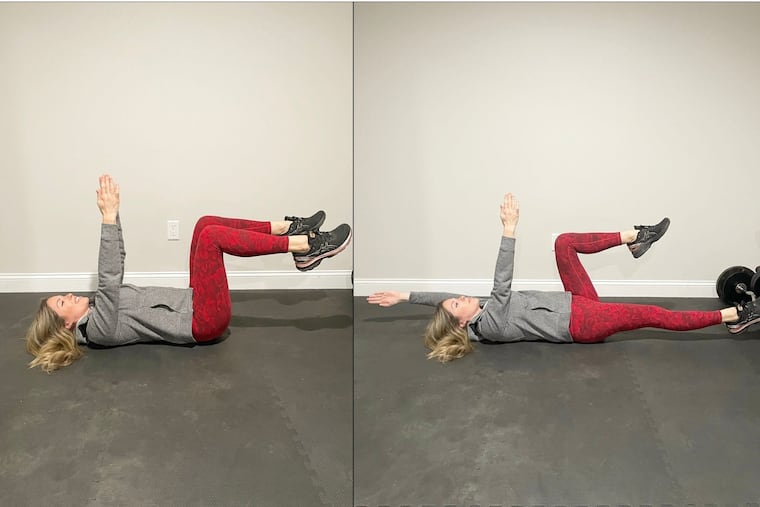 Demonstrating the "dead bug" exercise.