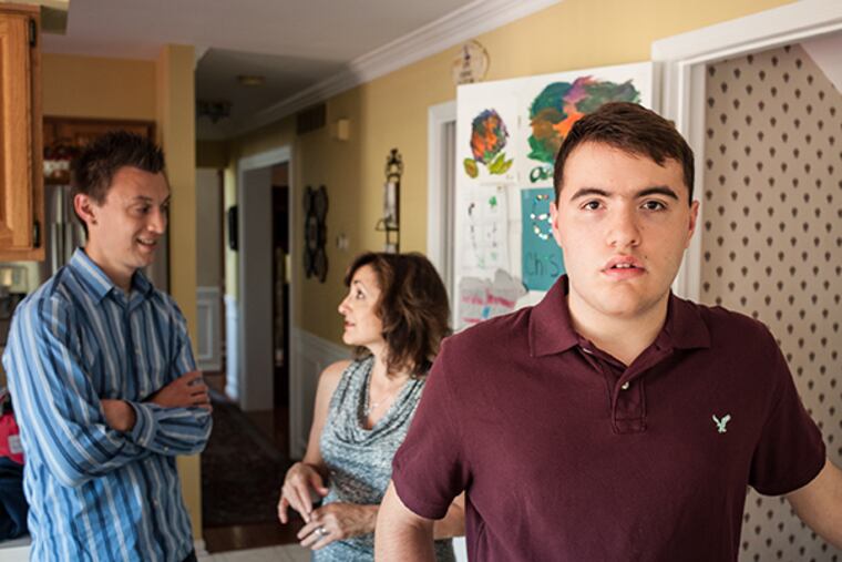 Chris Velikaris, 17, has received day-long, one-on-one educational support from Josh Jefferson (left) for the last five years. Proposed funding changes at Perkiomen Valley High School might mean that Josh will be replaced in favor of a new service provider. Friday, May 8, 2015, Schwenksville, Pennsylvania. ( MATTHEW HALL / For The Inquirer )