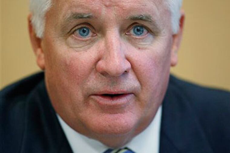 It's too hard to separate politics from the official actions of Pennsylvania Attorney General Tom Corbett. (AP Photo / Matt Rourke)