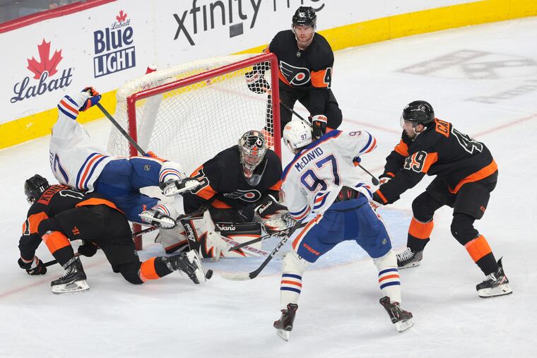 Carter Hart stops a shot from Connor McDavid of the Edmonton Oilers during the third period on Thursday night.