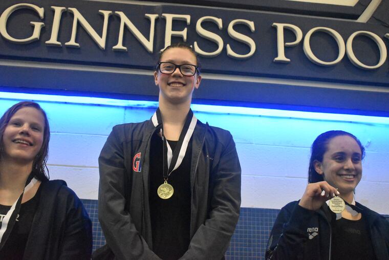 Emma Atkinson (center) after one of her three victories at Easterns.