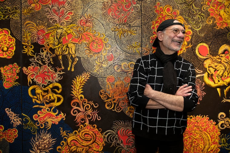 Artist Henry Bermudez in front of his 2007 painting 'The Heavens,' at the opening reception for his exhibit Wilderness in Mind, at Taller Puertorriqueño on Feb. 7, 2020.