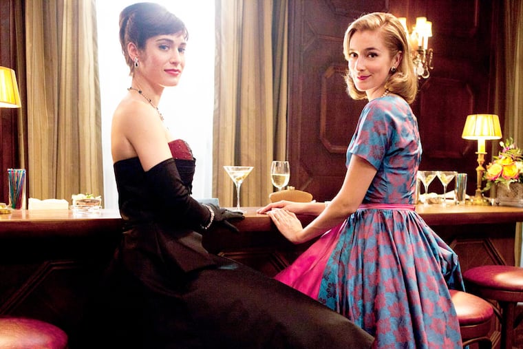 Lizzy Caplan, left, as Virginia Johnson and Caitlin Fitzgerald as Libby Masters in "Masters of Sex."