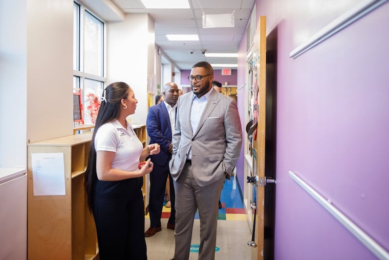 Susann DiPersia, childcare director at the Roxborough YMCA, chats with Lt. Gov. Austin Davis during a tour of the facility, including its pre-K clasrooms.