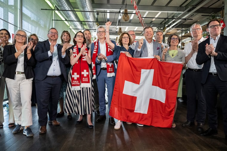 Members of the Federal Parliament and other representatives of civic organizations celebrate during a get together of a cross-party alliance against the SVP's popular initiative "No 10-Million Switzerland" which the people and the cantons voted on this election Sunday, June 14, 2026, in Bern, Switzerland.