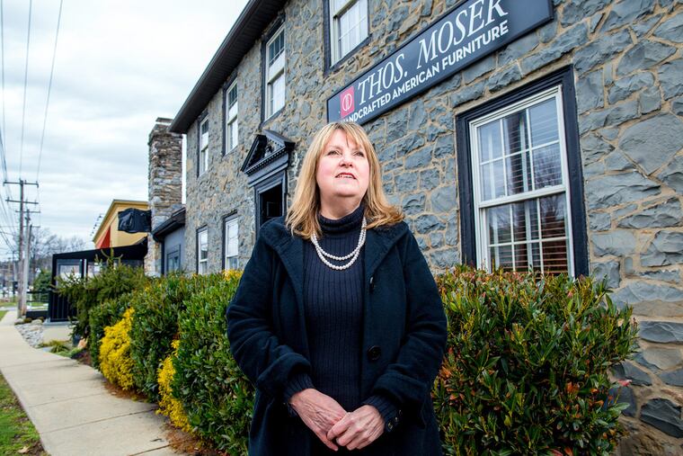 Pattye Benson outside the historic Old Covered Wagon Inn building in Wayne.
