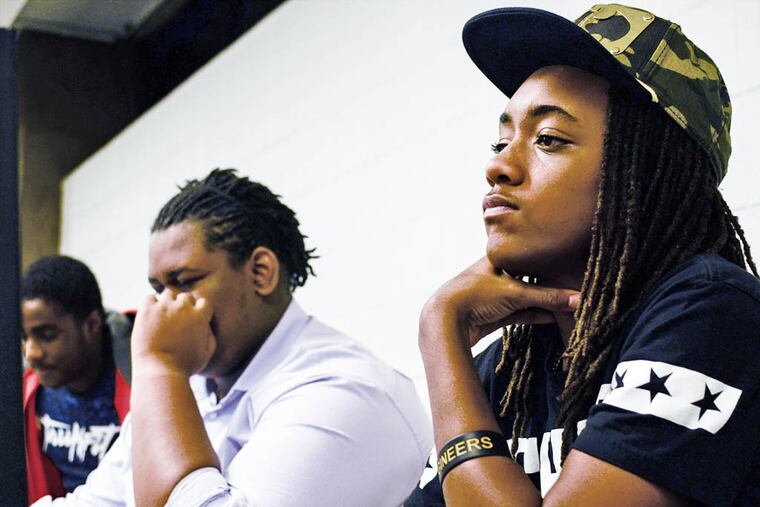 Trace Ball, 15, of Overbrook Park, works on developing an app that allows users to report crimes in the city.