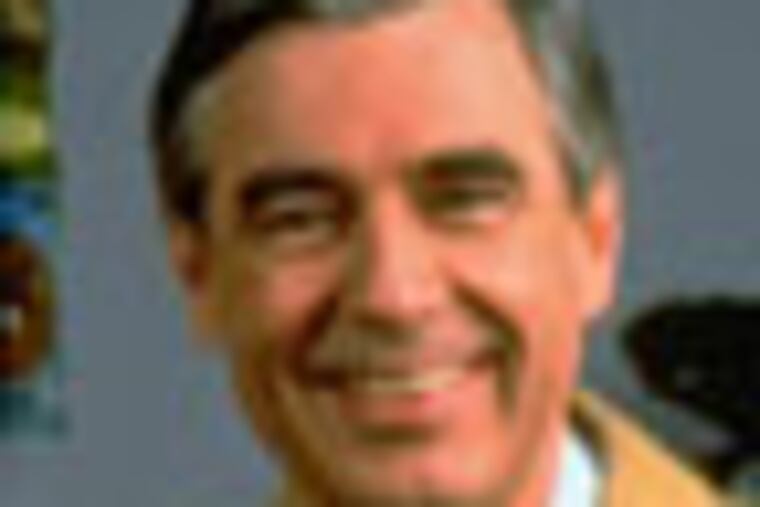 Fred Rogers poses on the Pittsburgh set of his television show Mister Rogers' Neighborhood, in this 1996 publicity photo. Rogers' new book, Dear Mister Rogers: Does It Ever Rain in Your Neighborhood?, is a treasury of letters from young viewers, and Rogers' responses. (AP Photo/pool)