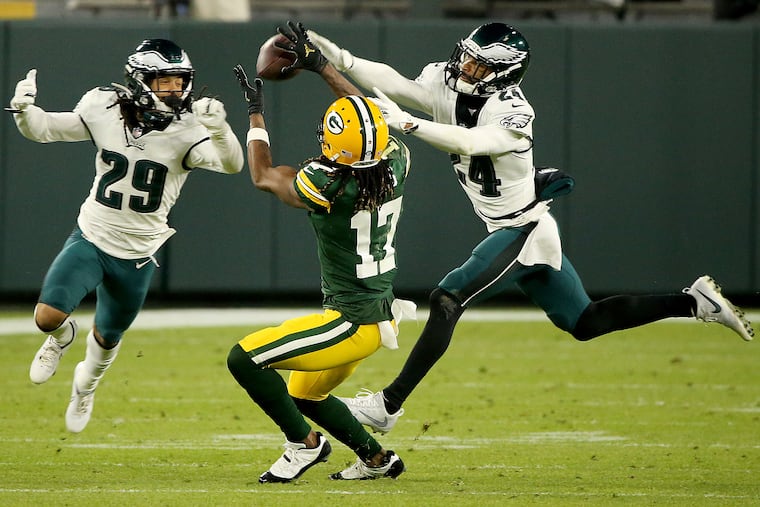 Avonte Maddox (left) and Darius Slay couldn't stop Davante Adams from catching this pass at Green Bay in December.