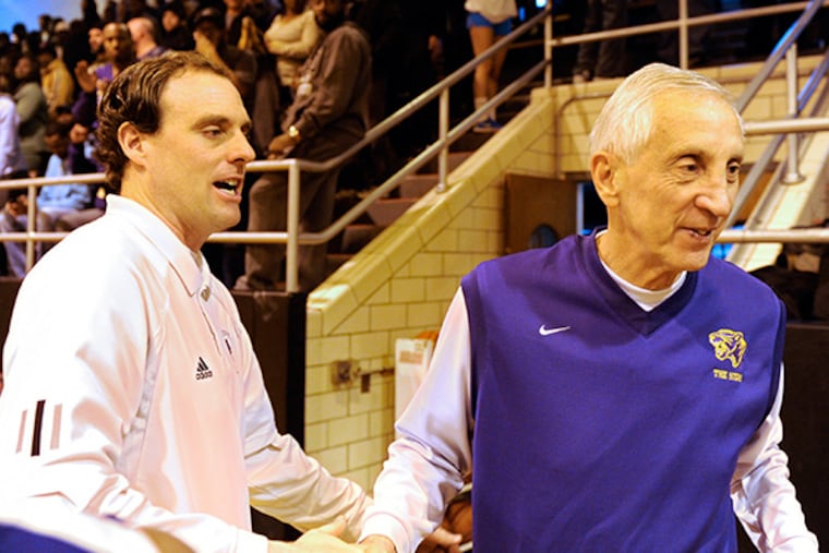 Previously undefeated Haddonfield Memorial High School coach Paul Wiedeman (left) congratulates Camden High School coach John Valore (right) after Camden upset Haddonfield in the South Jersey Group 2 semifinals March 8, 2014. ( TOM GRALISH / Staff Photographer )