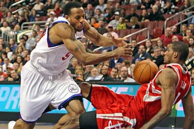 Sixers' Andre Iguodala is fouled by Rockets' Trevor Ariza during the
4th quarter. Rockets win 96-91. ( Steven M. Falk / Staff Photographer )