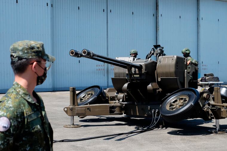 Taiwanese soldiers operate a Oerlikon 35mm twin cannon anti-aircraft gun at a base in Taiwan's southeastern Hualien county on Thursday.