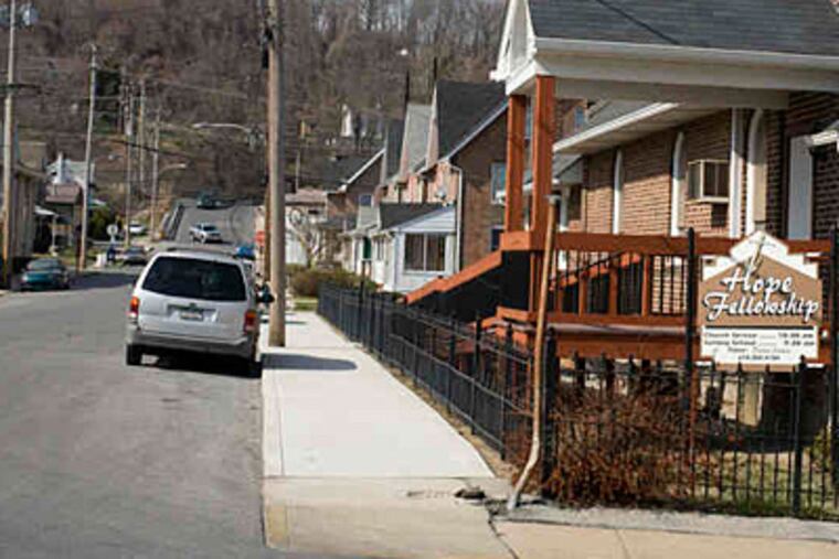 The 100 block of Hope Avenue in Coatesville, where a trash fire Friday night was ruled arson. A nearby swing-set fire also was set. (Rahul Coutinho / Staff photographer)