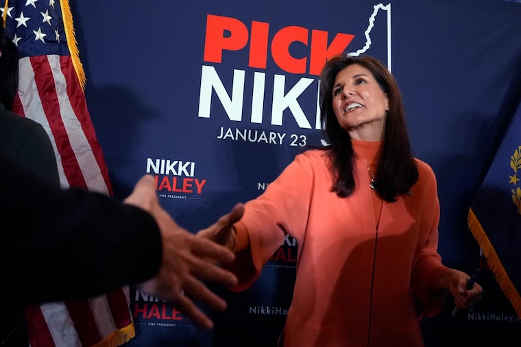 Republican presidential candidate and former U.N. Ambassador Nikki Haley shakes hands during a campaign stop in Bretton Woods, N.H. (AP Photo/Charles Krupa)
