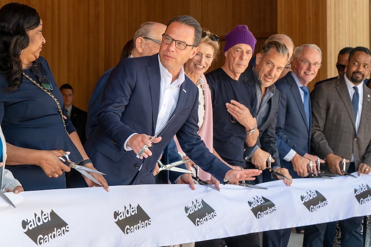 Gov. Josh Shapiro (second from left); looks to Jazelle Jones (left), city representative and director of special events, as they prepare to cut the ribbon at the Calder Gardens on the Benjamin Franklin Parkway on Monday.