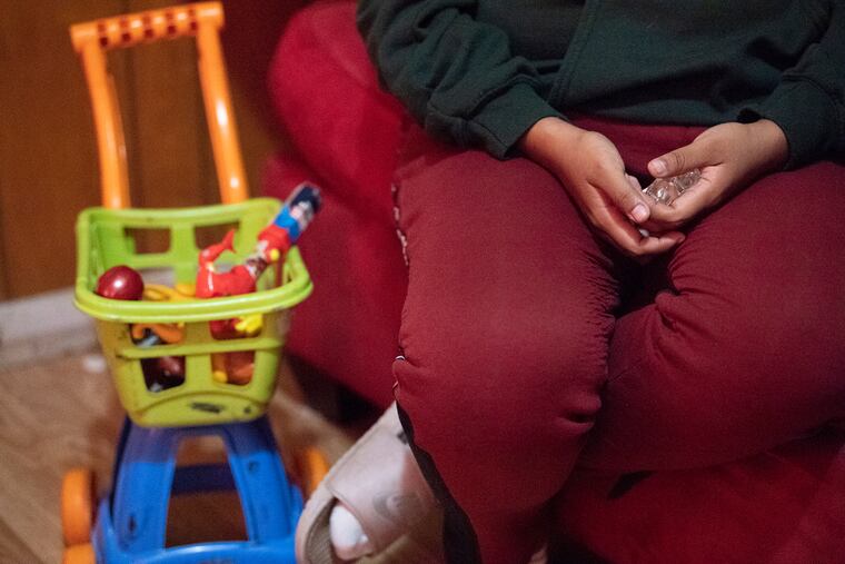 Noema Allavez Perez ,mother of missing 5-year old Dulce Maria Alavez, holds a crystal cross in her hands during an interview at her home in Bridgeton, N.J. Wednesday, September 18, 2019.