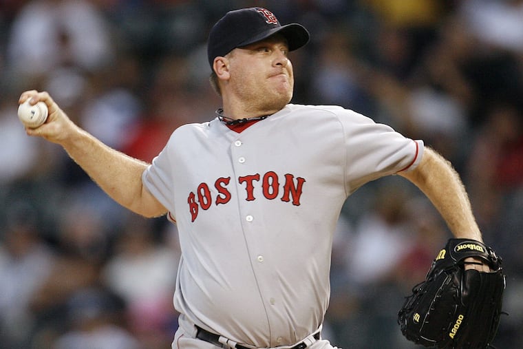 Boston Red Sox starting pitcher Curt Schilling delivers a pitch against the Chicago White Sox during the first inning of the second game of a baseball doubleheader Friday, Aug. 24, 2007, in Chicago.